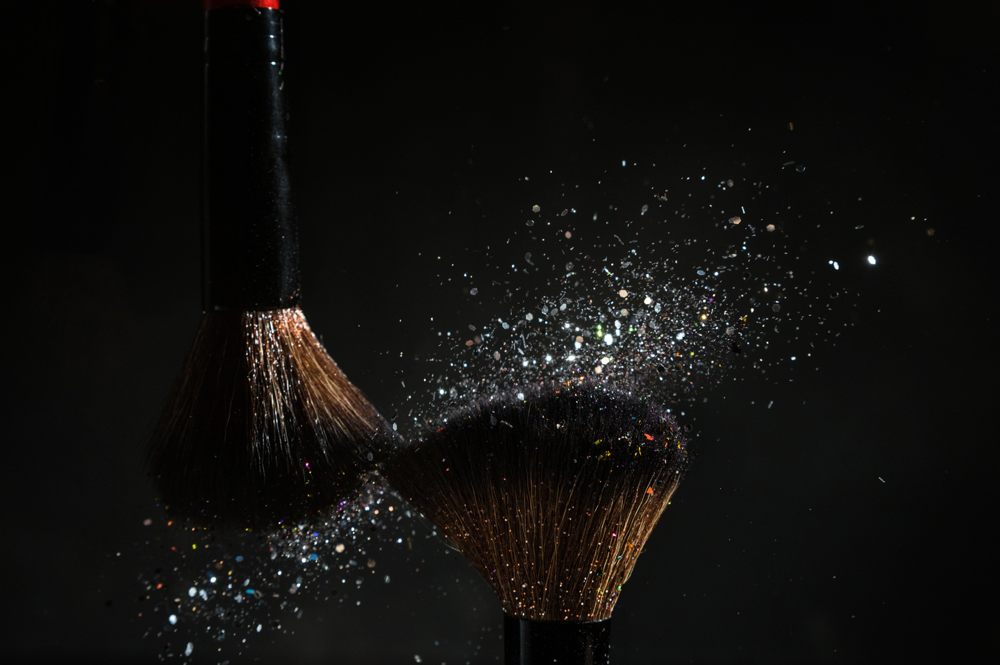 Makeup brush with blue glitter dust